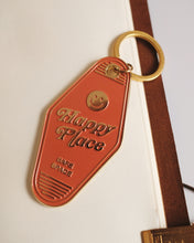 Load image into Gallery viewer, Orange keychain tag with &#39;Happy Place&#39; text and smiley face on a white background
